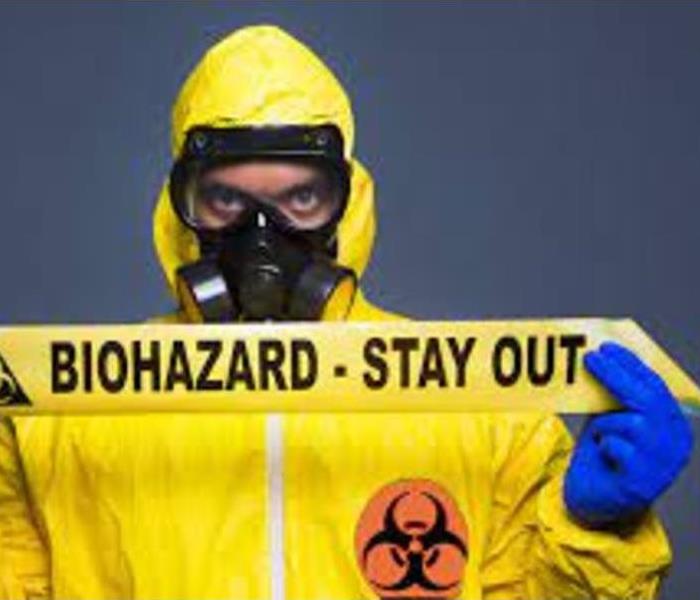 Man holding a biohazard sign